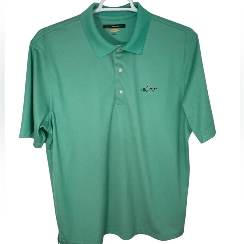 Greg Norman green golf polo shirt for Men size Large.